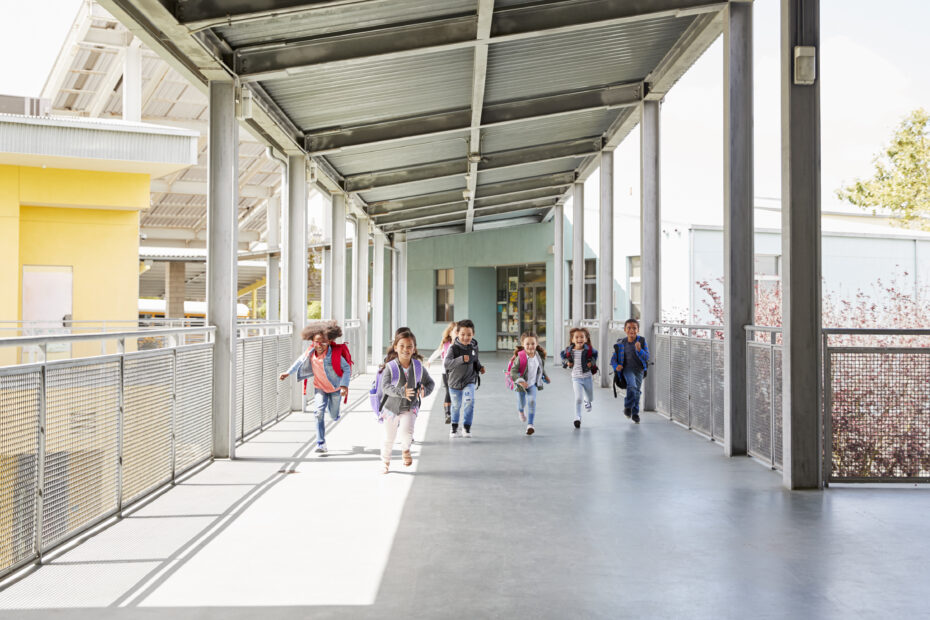 school kids running in the school