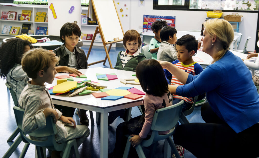 teacher kids crafting at school