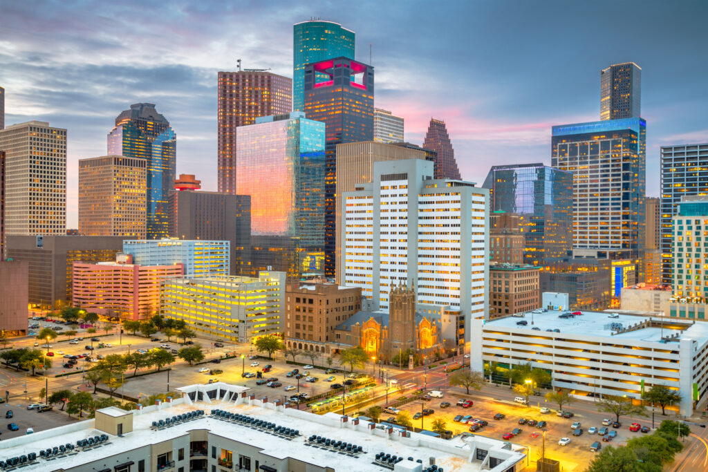 Houston, Texas, USA rooftop downtown city skyline at dusk