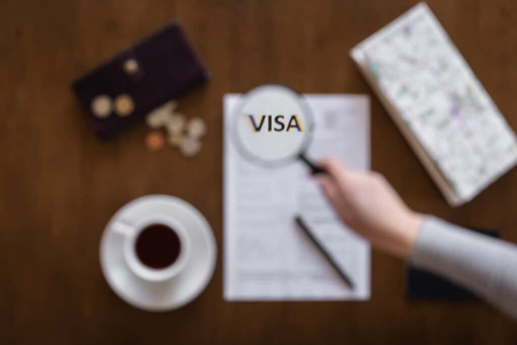 Visa application form on a wooden table