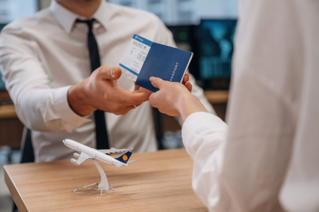 Woman is giving boarding pass　tickets